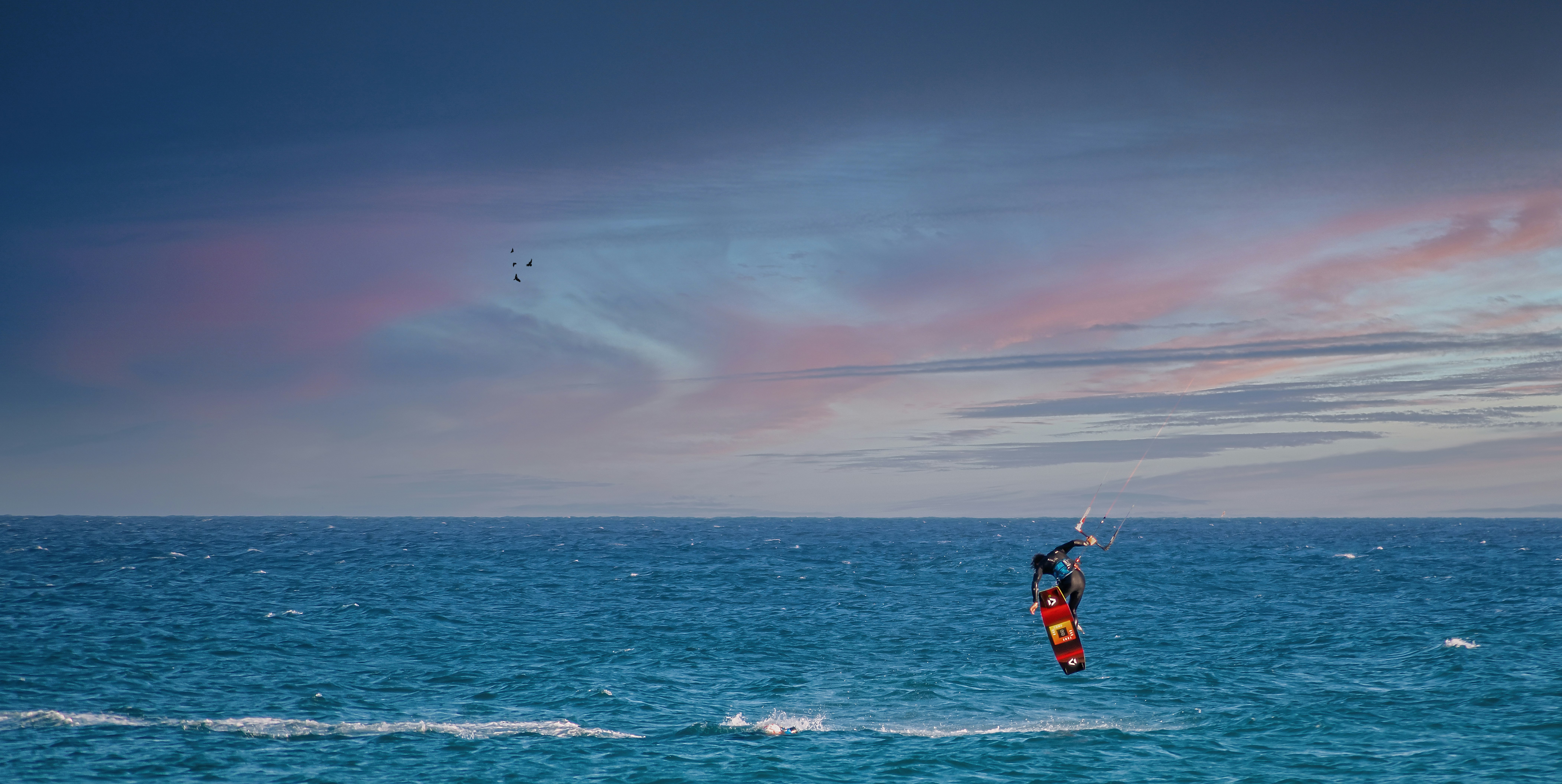 person surfing on sea during daytime